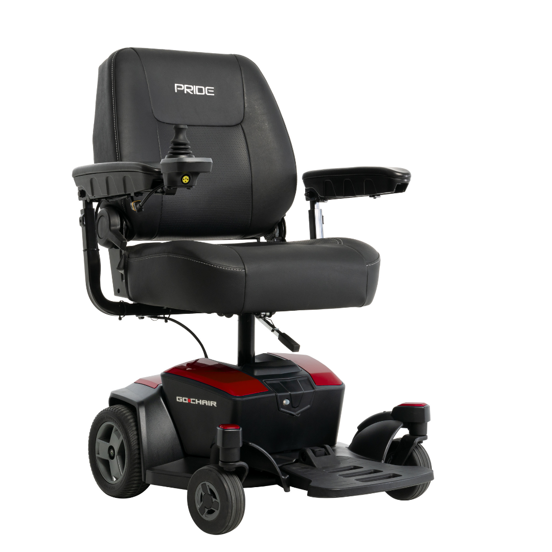 The Pride Mobility Go Chair® Portable Powerchair features a black design with armrests, padded seat and backrest, joystick controls, footrest, and four-wheel base for stability. Its compact turning radius allows easy maneuvering in tight spaces.